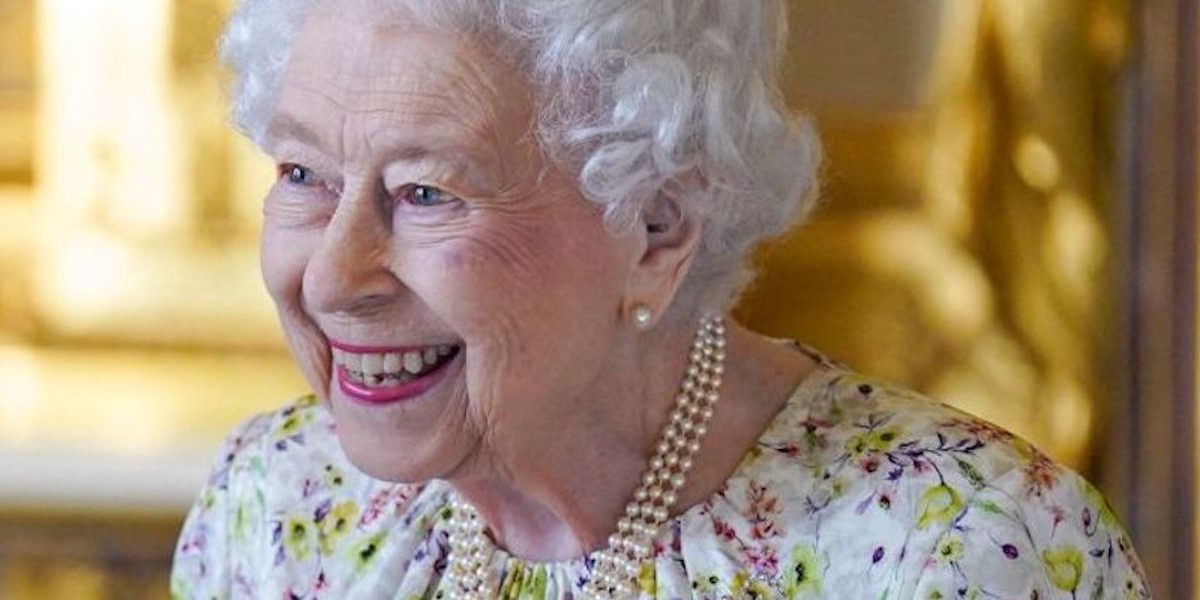 Britain's Queen Elizabeth II smiles as she arrives to view a display of artefacts from Halcyon Days to commemorate the company's 70th anniversary in the White Drawing Room at Windsor Castle on March 23, 2022. - The Queen viewed a selection of hand-decorated archive enamelware and fine bone china from Halcyon Days, including their earliest designs from the 1950s. (Photo by Steve Parsons / POOL / AFP) (Photo by STEVE PARSONS/POOL/AFP via Getty Images)